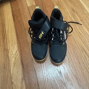 Under Armour Kids Black and Gold Sneakers